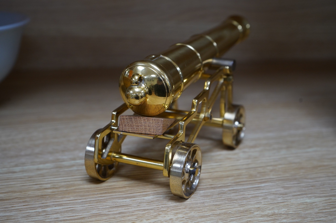 A modern brass model of a 17th century cannon, barrel 19cm long. Condition - good